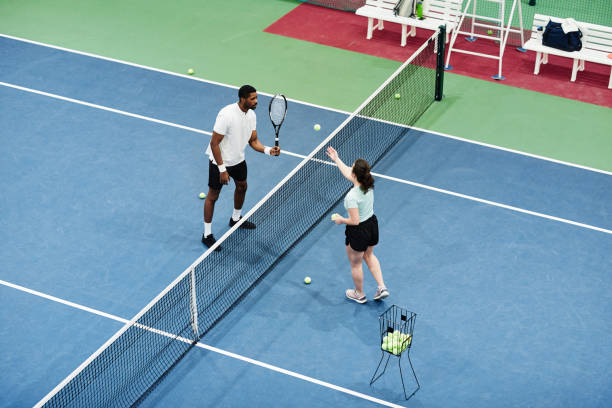 istock Friends at Tennis Match Top View 1398695021