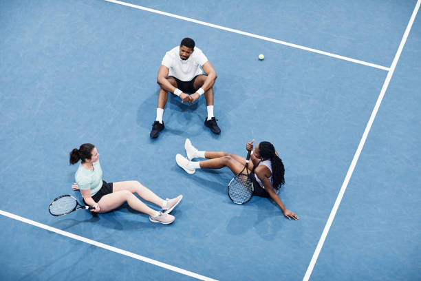 istock Team Relaxing at Tennis Court 1398695346