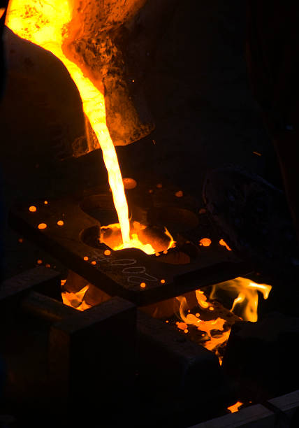 Molten Metal Flowing into Mold stock photo