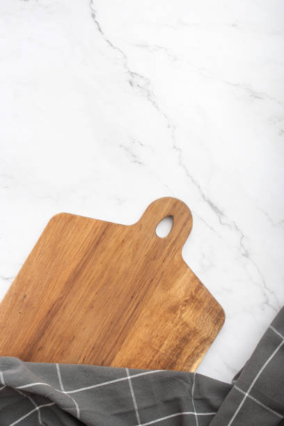 istock culinary background with wooden cutting board and towel on granite table 1398700208