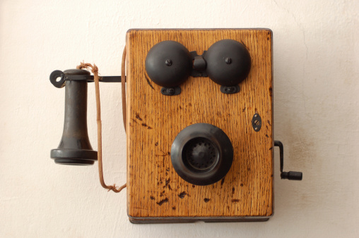 Shot of an antique wooden crank telephone.