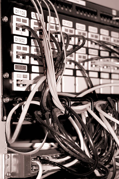 Old network rack Old network rack. B&W Sepia with some flash shadowes to give it a 70's look. computer network router communication internet stock pictures, royalty-free photos & images