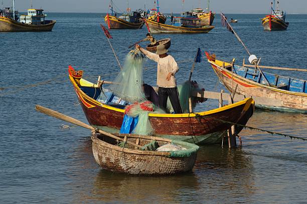 istock Fisherman in his boat 139870402