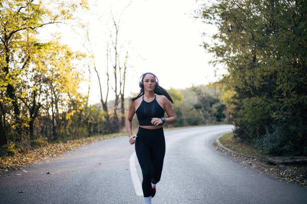 istock young woman exercising in nature 1398705630