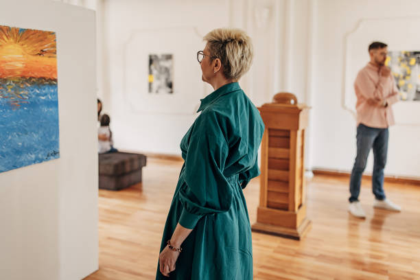 istock Woman looking at art 1398707752