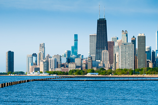 Chicago skyline with blue Lake Michigan waters in the foreground.