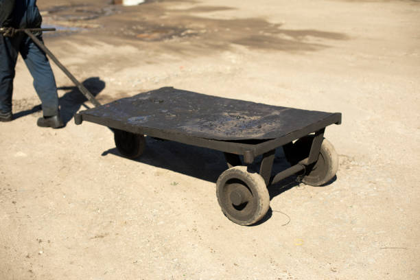 Truck for cargo. Transporter of goods. Warehouse tools. Wheelbarrow for transportation.