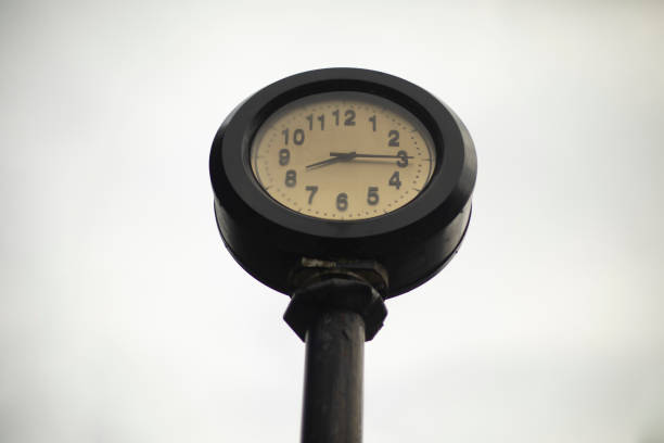 istock Post clock. Glittering clock against sky. Dial is outside. 1398713876