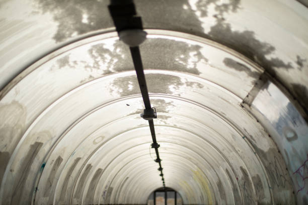 Tunnel made of plastic. Snow on dome. Outgoing perspective. Architecture details. Interior of tunnel.