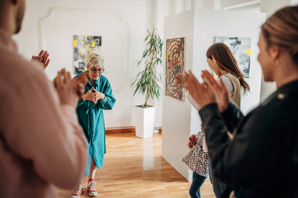 istock Female artist at gallery opening 1398714161