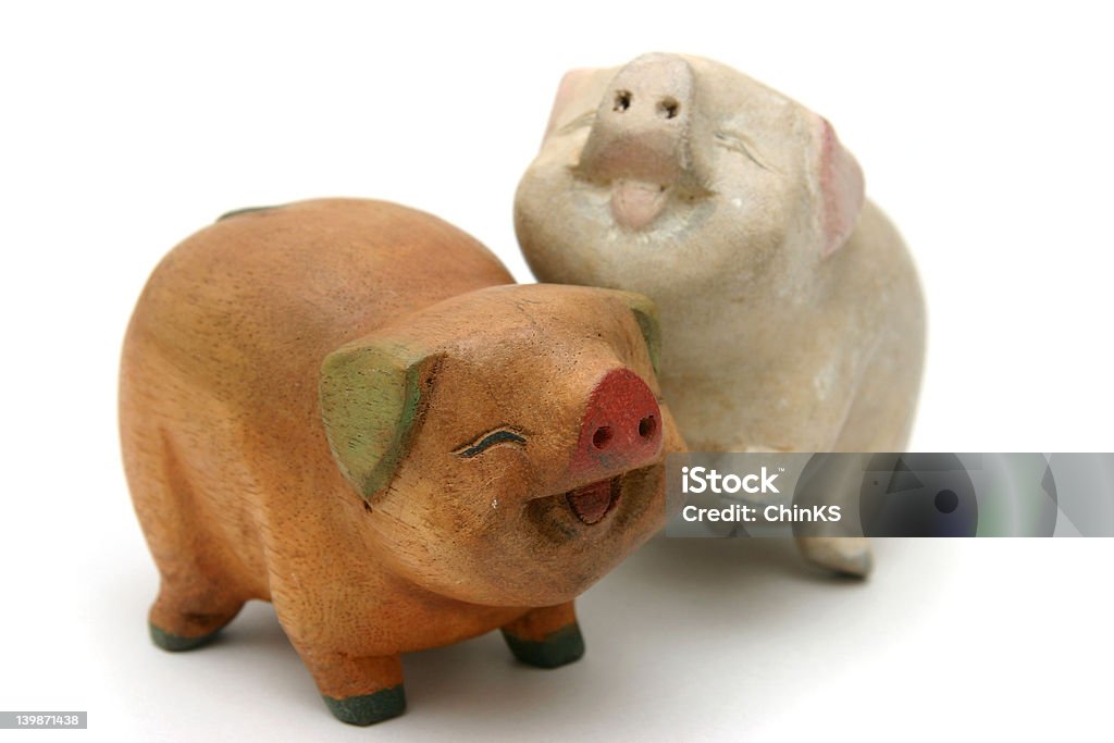 Wooden pigs Cheerful and decorative piggy wood carvings for interiors or as gifts Agricultural Fair Stock Photo