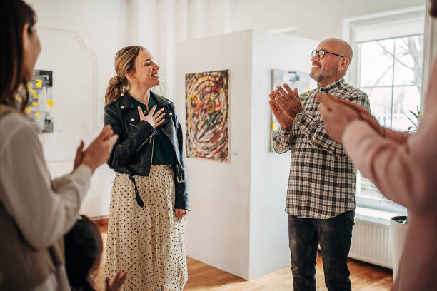 istock People applauding at gallery opening 1398714756