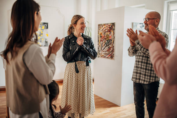 istock People applauding at gallery opening 1398714816