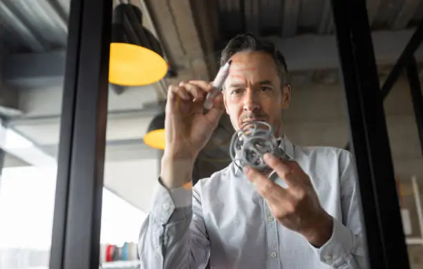 Photo of Designer working at a creative office on a 3D model