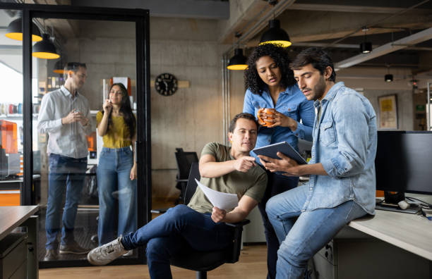 Group of workers working at a creative office stock photo