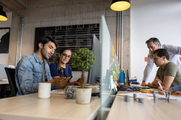 istock Group of workers working at the office 1398717780