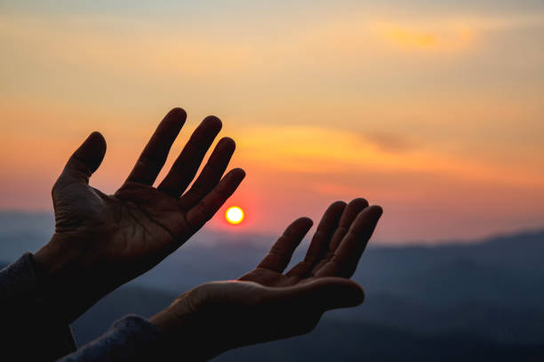 istock woman worship on sunset 1398723423