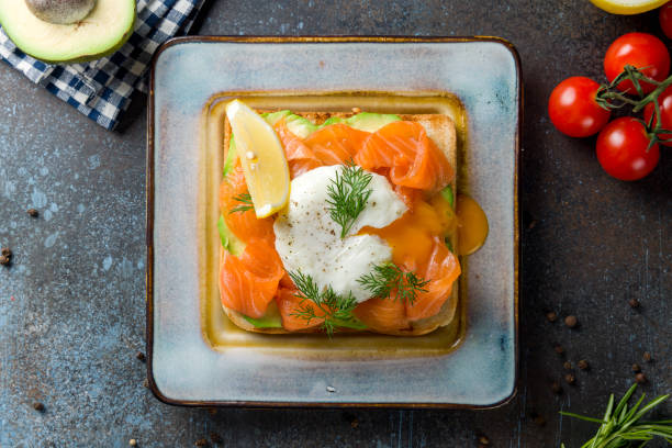 istock poached egg with salmon and avocado on bread, bruschetta, sandwich on dark stone table top view 1398727928