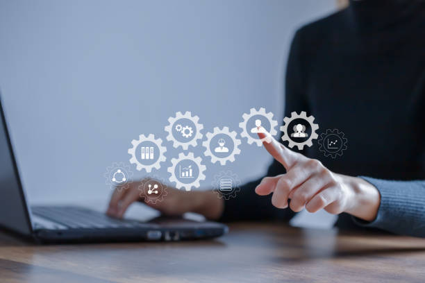 istock Human resource management concept. HR is working with computers and points the finger at the people icon and other human resource icons. 1398728813