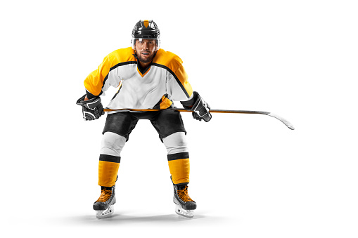 Professional hockey player. Sports emotions.Isolated on the white. Hockey player in the helmet and gloves on white background. Man