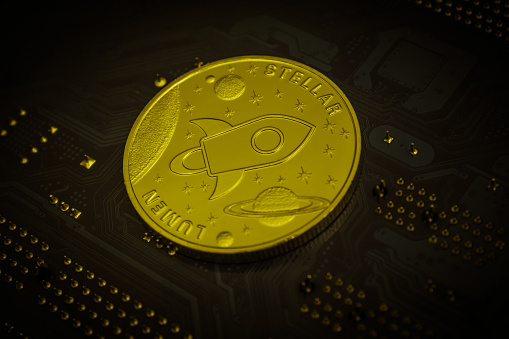 Closeup shot of one golden stellar coin over motherboard