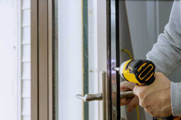istock Locksmith install the door lock in house. 1398731772