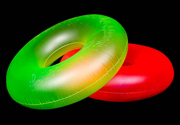 paar aufblasbarer runde pool-röhren - inflatable inner tube toy life belt stock-fotos und bilder