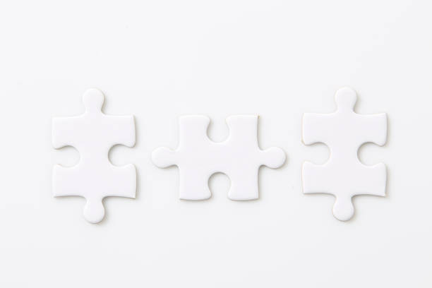 istock Connection metaphor. Blank three pieces of white puzzle on white background 1398742147