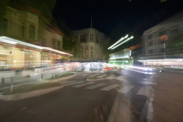 Whanganui New Zealand - April 9 2022; Night time in the city in zoom blur conveying frenetic urban pace of life and background