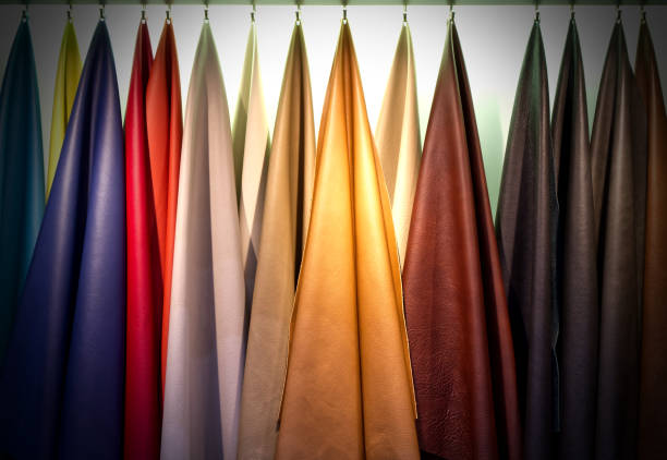 istock Colorful of cowhide hanging on white background, Materials for use in leather work 1398743609