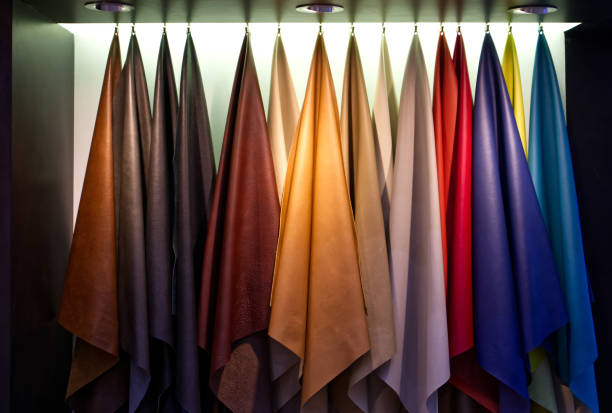 istock Colorful of cowhide hanging on white background, Materials for use in leather work 1398743610