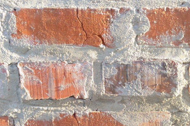 Brick red wall texture sunlight, masonry close-up stock photo