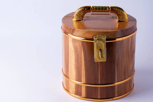 istock Wooden savings bank with a key lock on the front 1398745463