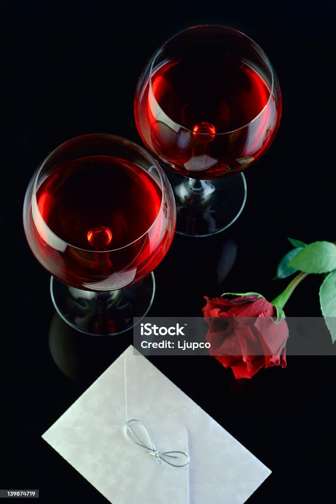 Wine glasses, rose and a letter Wine glasses, rose and a proposal letter Drinking Glass Stock Photo