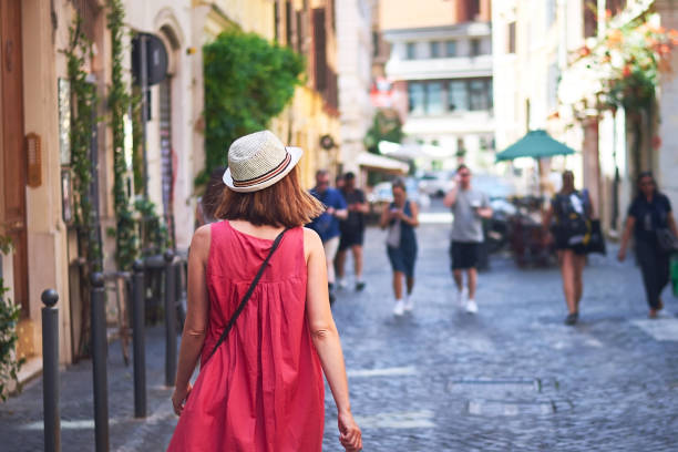 istock Woman walking on street. 1398749480