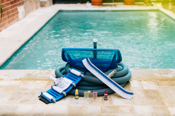 istock Image of pool cleaning and maintenance kit, vacuum cleaner, ph test, leaf picker and pool sweeper, Pool cleaning and maintenance tools 1398757897