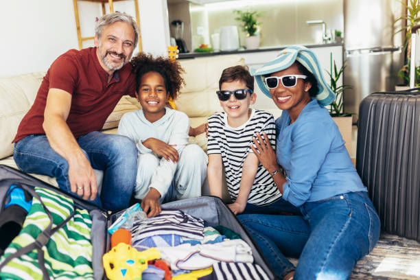 istock Happy family  packing for summer holidays 1398758026