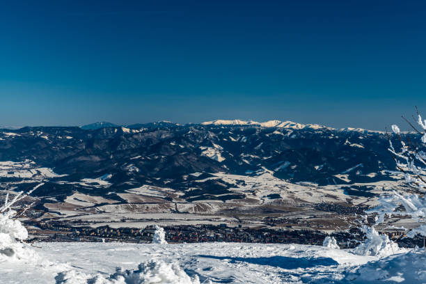 Martin town, Velka Fatra and highest part of Nizke Tatry mountains from Velka luka hiill in Mala Fatra mountains in Slovakia Martin town, Velka Fatra and highest part of Nizke Tatry mountains from Velka luka hiill in Mala Fatra mountains in Slovakia during beautiful winter day durkova stock pictures, royalty-free photos & images
