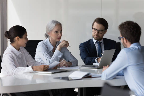 istock Diverse recruit team meeting, talking to job candidate for interview 1398758182