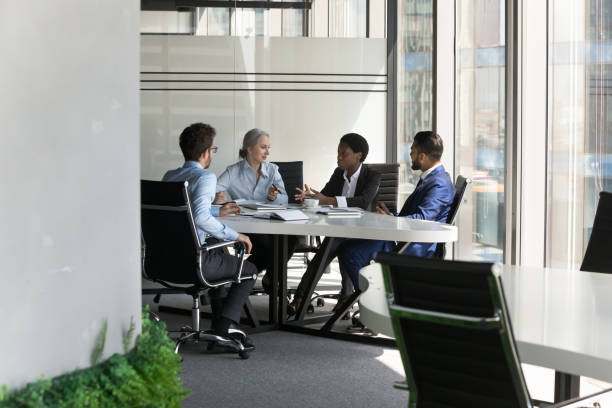 istock Multiethnic business team discussing project in meeting room 1398758196