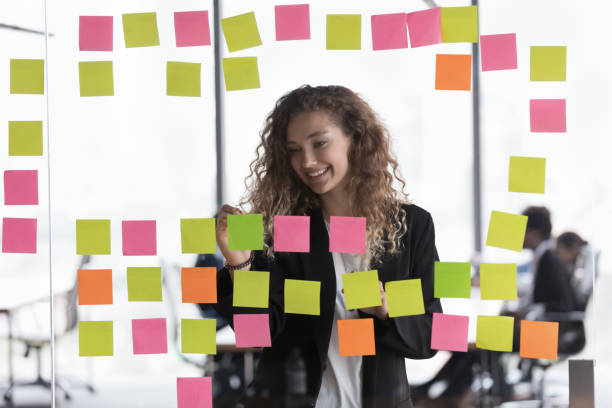 istock Happy satisfied young project leader working on tasks management 1398758275