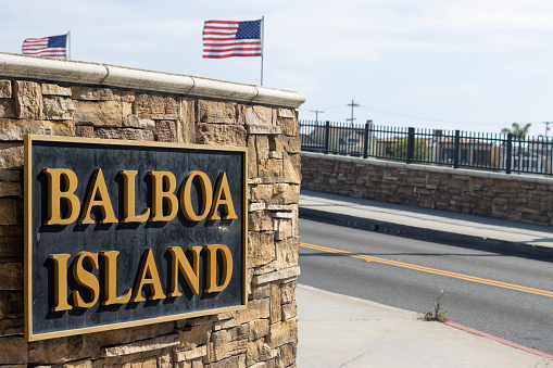 Closeup of the Balboa Island sign on the Balboa Island channel bridge in Newport Beach, California.
