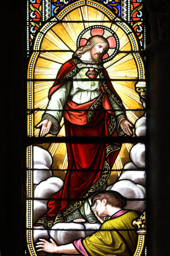 stained glass church window with image of jesus
