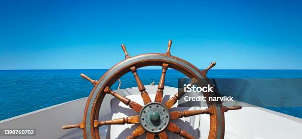 Ships Wheel On The Sea Stock Photo - Download Image Now - Sailboat, Sailing, Helm - Nautical Vessel Part
