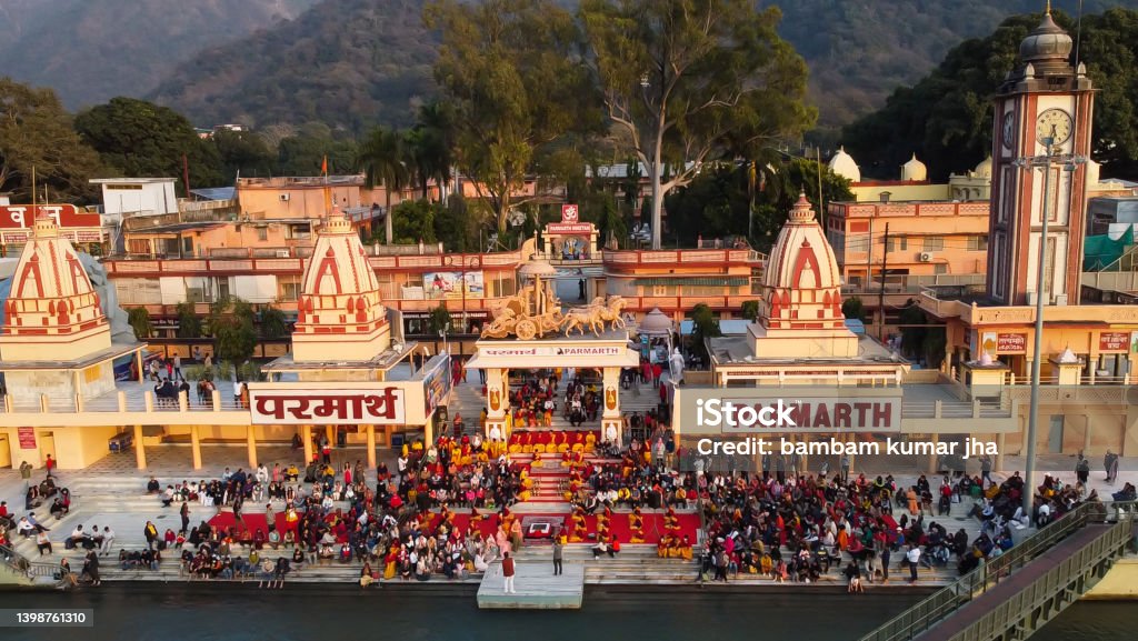 hindu temple filled with crowed at evening form religious prayer hindu temple filled with crowed at evening form religious prayer image is taken at parmarth niketan rishikesh uttrakhand india on Mar 15 2022. Rishikesh Stock Photo
