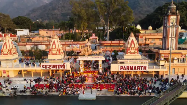 hindu temple filled with crowed at evening form religious prayer image is taken at parmarth niketan rishikesh uttrakhand india on Mar 15 2022.