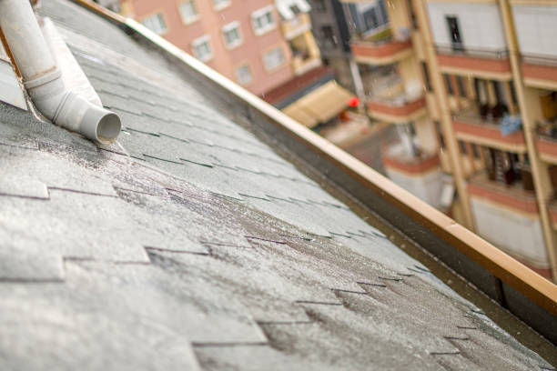 istock Rain storm water draining into roof edge gutter 1398762598