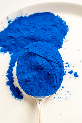 Butterfly pea flower powder or blue matcha, top view.