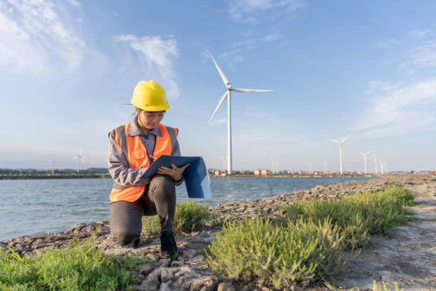 istock An Asian female wind power engineer squatted on the ground to check the data 1398762867