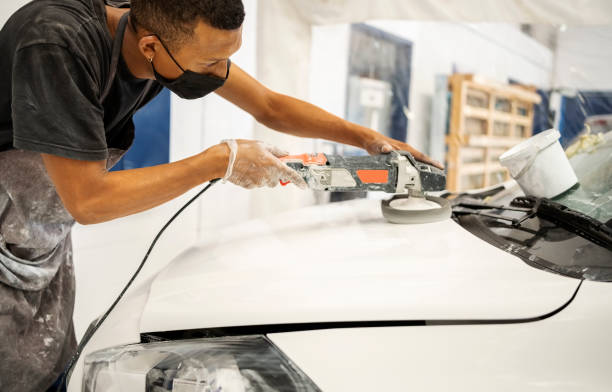 istock Worker preparing the car surface before coating at auto repair shop 1398762914